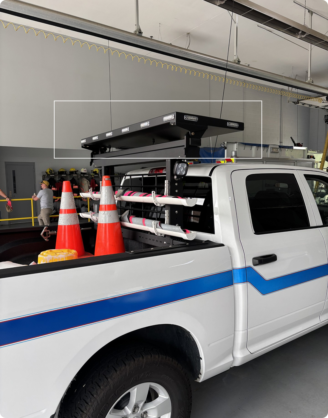 white work truck with message board
