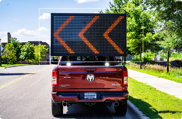 red pickup truck with LED sign
